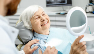 old lady just after dental implants
