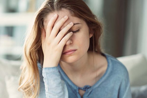 Woman with Head Ache